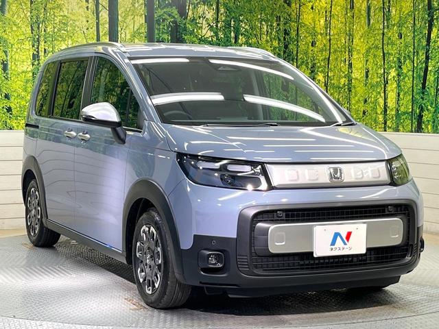 フリード クロスター　登録済未使用車　純正９型ナビ　バックカメラ　ホンダセンシング　レーダークルーズ　両側電動ドア　ハーフレザー　シートヒーター　ブラインドスポットモニター　オートエアコン　スマートキー　ＬＥＤヘッド（17枚目）