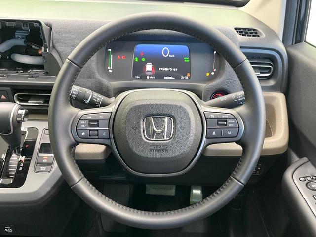 フリード ｅ：ＨＥＶエアー　ＥＸ　登録済未使用車　ホンダセンシング　アダプティブクルーズ　両側電動ドア　シートヒーター　ステアリングヒーター　ブラインドスポットモニター　ＬＥＤヘッド　オートハイビーム　オートエアコン　スマートキー（12枚目）