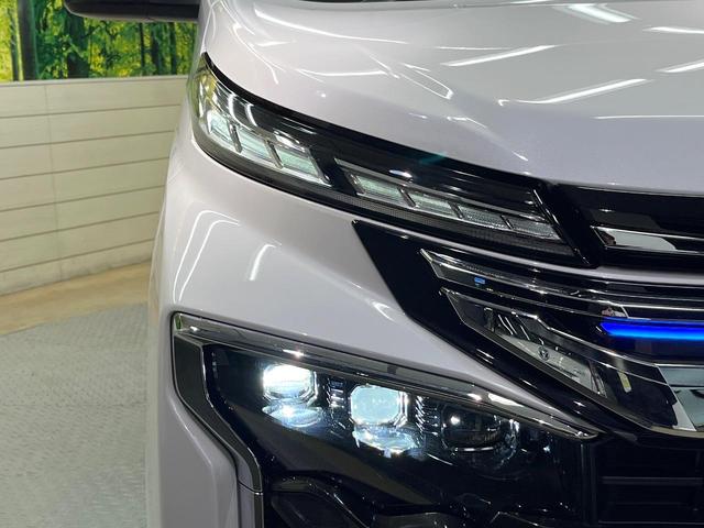 ヴォクシー ハイブリッドＳ－Ｚ　フリップダウンモニター　ドライビングサポートパッケージ　純正１０．５型ナビ　バックカメラ　ブラインドスポットモニター　３眼ＬＥＤヘッド　両側電動ドア　リアオートエアコン　シートヒーター　スマートキー（23枚目）