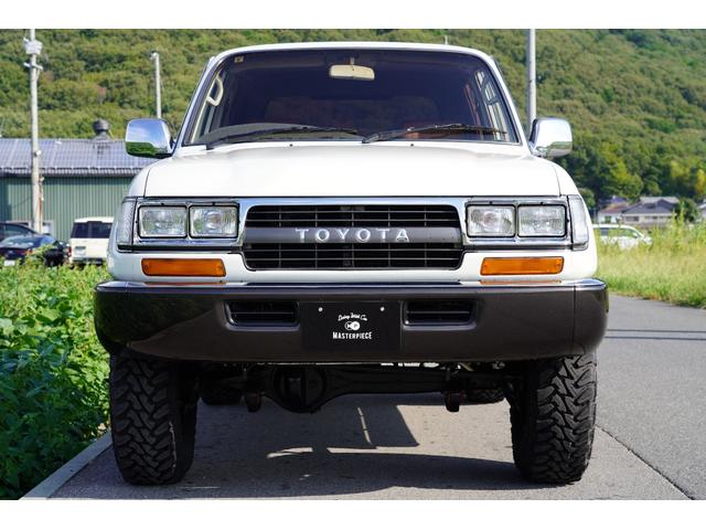 ランドクルーザー８０ ＶＸ　自社保証付！！　５速ＭＴ　ダッシュ割れ無し　リフトアップ　サイドマフラー　輸出用角目４灯ヘッドライト　フロント純正新品マット付属　ＲＡＮＣＨＯショック（2枚目）