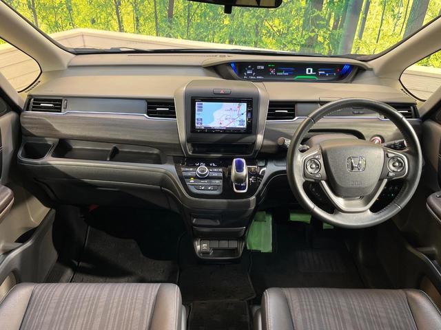 フリード+ハイブリッド ハイブリッドEX 純正ナビ バックカメラ 衝突軽減ブレーキ レーダークルーズコントロール 両側電動スライドドア 前席シートヒーター オートライト オートエアコン 純正15インチアルミホイール ロールサンシェード(2枚目)