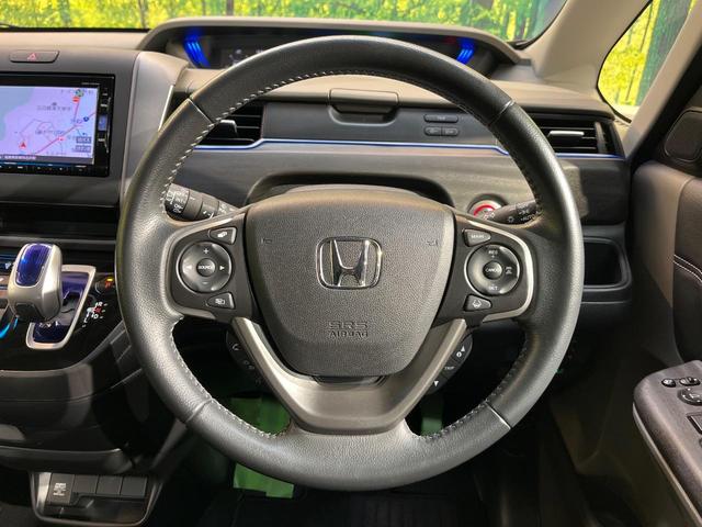 フリード+ハイブリッド ハイブリッドEX 純正ナビ バックカメラ 衝突軽減ブレーキ レーダークルーズコントロール 両側電動スライドドア 前席シートヒーター オートライト オートエアコン 純正15インチアルミホイール ロールサンシェード(12枚目)