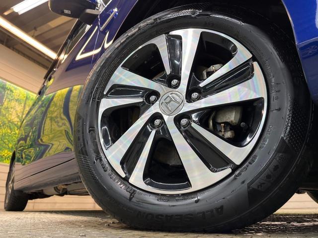 フリード+ハイブリッド ハイブリッドEX 純正ナビ バックカメラ 衝突軽減ブレーキ レーダークルーズコントロール 両側電動スライドドア 前席シートヒーター オートライト オートエアコン 純正15インチアルミホイール ロールサンシェード(14枚目)