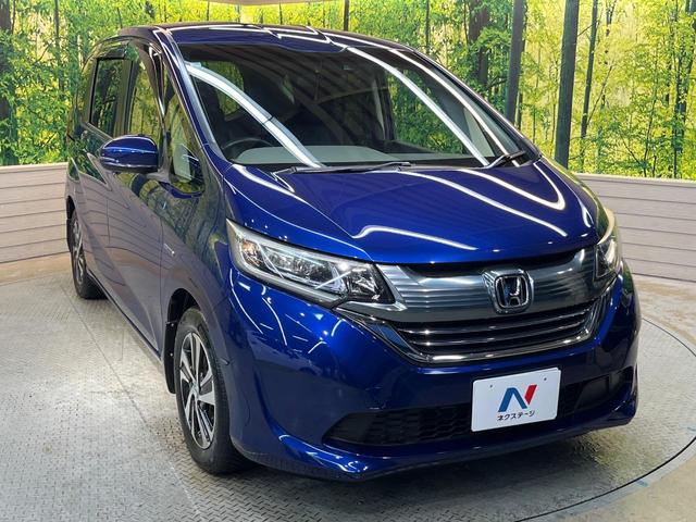 フリード+ハイブリッド ハイブリッドEX 純正ナビ バックカメラ 衝突軽減ブレーキ レーダークルーズコントロール 両側電動スライドドア 前席シートヒーター オートライト オートエアコン 純正15インチアルミホイール ロールサンシェード(17枚目)