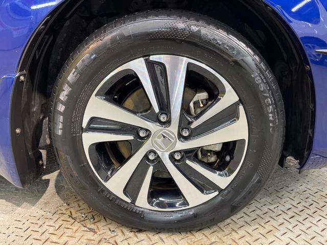 フリード+ハイブリッド ハイブリッドEX 純正ナビ バックカメラ 衝突軽減ブレーキ レーダークルーズコントロール 両側電動スライドドア 前席シートヒーター オートライト オートエアコン 純正15インチアルミホイール ロールサンシェード(63枚目)