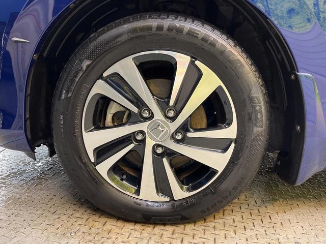 フリード+ハイブリッド ハイブリッドEX 純正ナビ バックカメラ 衝突軽減ブレーキ レーダークルーズコントロール 両側電動スライドドア 前席シートヒーター オートライト オートエアコン 純正15インチアルミホイール ロールサンシェード(66枚目)