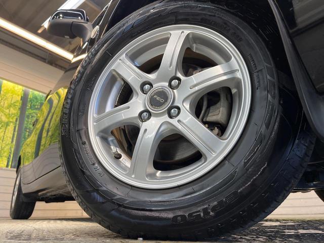 ノート Ｘ　禁煙車　スマートキー　ＥＴＣ　純正オーディオ　１４インチアルミホイール　アイドリングストップ　電動格納ミラー　ＣＤ再生　プッシュスタート　プライバシーガラス　黒内装（13枚目）