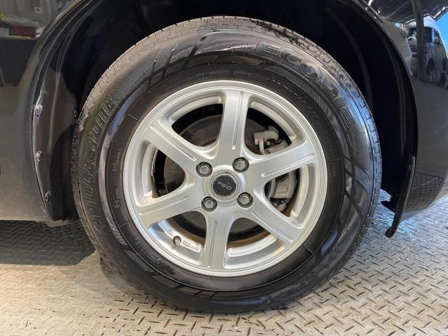 ノート Ｘ　禁煙車　スマートキー　ＥＴＣ　純正オーディオ　１４インチアルミホイール　アイドリングストップ　電動格納ミラー　ＣＤ再生　プッシュスタート　プライバシーガラス　黒内装（49枚目）