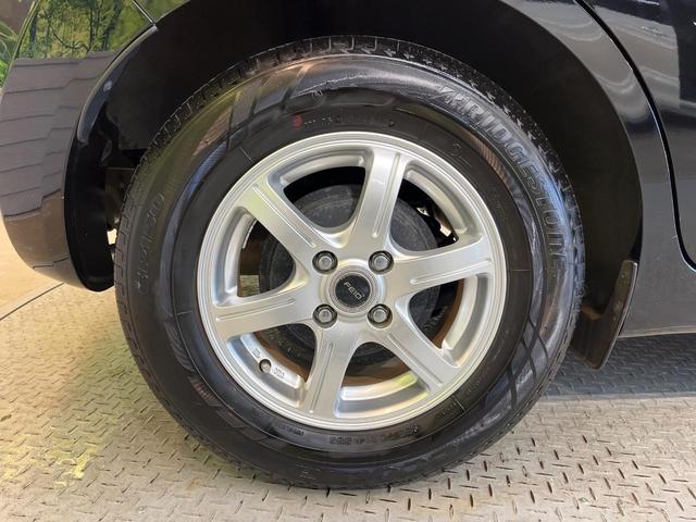 ノート Ｘ　禁煙車　スマートキー　ＥＴＣ　純正オーディオ　１４インチアルミホイール　アイドリングストップ　電動格納ミラー　ＣＤ再生　プッシュスタート　プライバシーガラス　黒内装（50枚目）