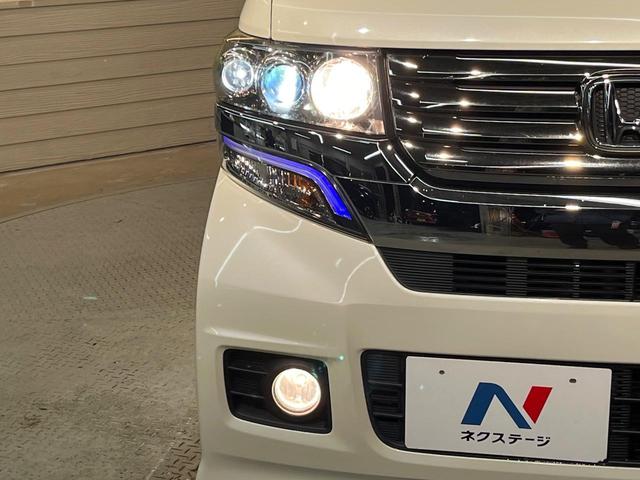 Ｎ－ＢＯＸカスタム Ｇ・Ｌパッケージ　ＳＤナビ　Ｂｌｕｅｔｏｏｔｈ　バックカメラ　電動ドア　ＥＴＣ車載器　横滑り防止装置　ＨＩＤヘッド　純正１４ＡＷ　ステリングスイッチ　スマートキー　アイドリングストップ　ワンオーナー　禁煙車（12枚目）