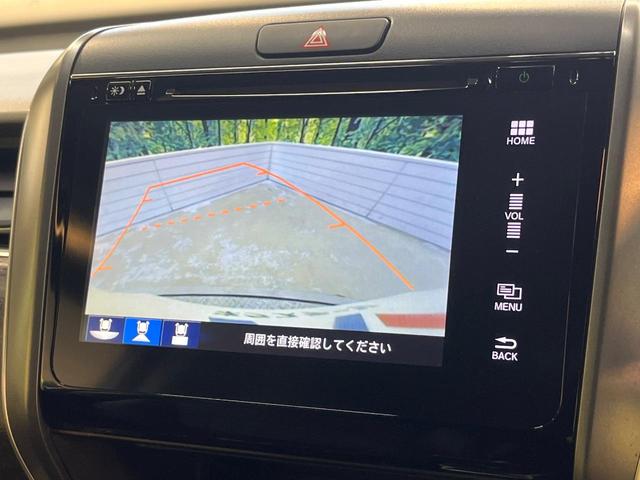 フリードハイブリッド ハイブリッド・EX ホンダセンシング メーカーナビ フリップダウン バックカメラ 両側電動ドア アダプティブクルーズ シートヒーター ハーフレザーシート LEDヘッド 純正15アルミ ドラレコ ETC 禁煙車(5枚目)