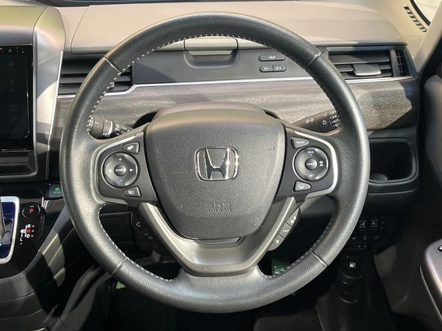 フリードハイブリッド ハイブリッド・EX ホンダセンシング メーカーナビ フリップダウン バックカメラ 両側電動ドア アダプティブクルーズ シートヒーター ハーフレザーシート LEDヘッド 純正15アルミ ドラレコ ETC 禁煙車(9枚目)