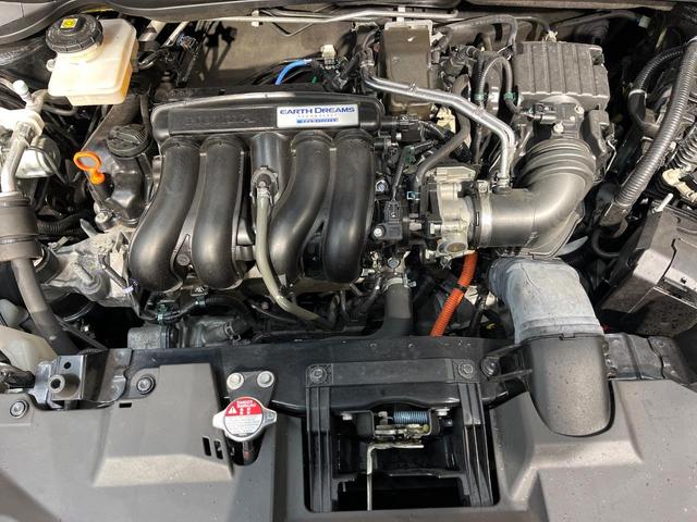 ヴェゼル ハイブリッドＸ・ホンダセンシング　ホンダセンシング　純正８型ナビ　バックカメラ　アダプティブクルーズ　タッチパネル式オートエアコン　ＥＴＣ　革巻きステリング　ＬＥＤヘッド　純正１６アルミ　ステアリングスイッチ　車線逸脱警報　禁煙車（18枚目）