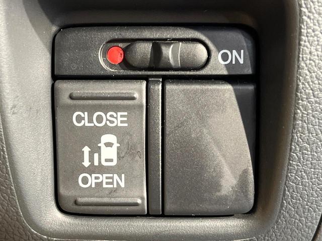 Ｎ－ＢＯＸカスタム Ｇ・Ｌパッケージ　純正ナビ　バックカメラ　電動パワースライドドア　ＥＴＣ車載器　オートエアコン　ステアリングスイッチ　ＨＩＤヘッド　純正１４アルミ　ブラックインテリア　スマートキー　アイドリングストップ　禁煙車（5枚目）