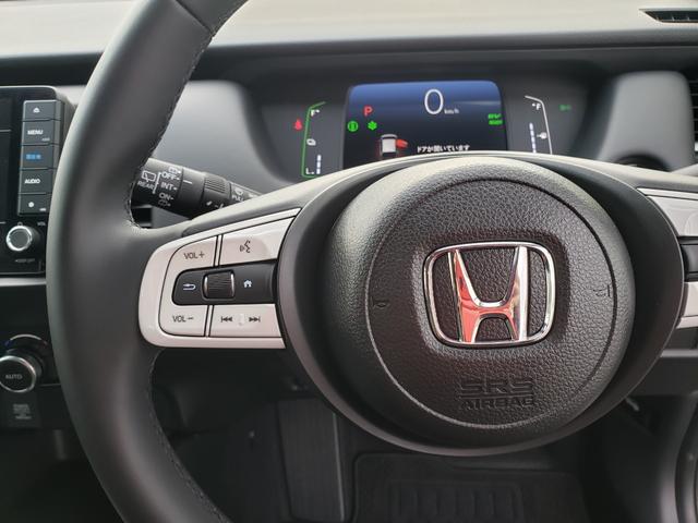 フィット ｅ：ＨＥＶホーム　ホンダセンシング　バックカメラ　純正９インチナビ　アダプティブクルーズコントロール　ＬＥＤヘッドライト　ＥＴＣ　電動格納ミラー　オートライト　オートエアコン　フルフラット　ＣＤ：ＤＶＤ　ＵＳＢ接続（20枚目）