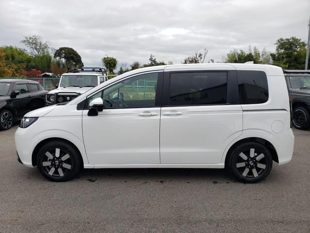 フリード ｅ：ＨＥＶエアー　ＥＸ　登録済未使用車　純正フルセグナビ　バックカメラ　アダプティブクルーズコントロール　後席エアコン　ＬＥＤヘッドライト　クリアランスソナー　シートヒーター　電動パーキング　純正アルミホイール（9枚目）