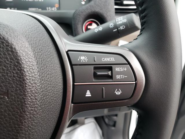 フリード ｅ：ＨＥＶエアー　ＥＸ　登録済未使用車　純正フルセグナビ　バックカメラ　アダプティブクルーズコントロール　後席エアコン　ＬＥＤヘッドライト　クリアランスソナー　シートヒーター　電動パーキング　純正アルミホイール（22枚目）