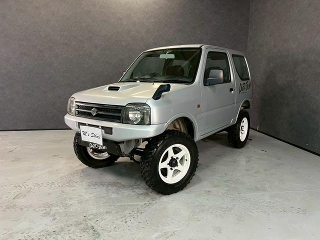 ジムニー ＸＧ　車検９年１０月　ターボ　４ＷＤ　５ＭＴ　マニュアルギヤシフト　キーレス　ＣＤ　ＡＢＳ　ＳＲＳエアバッグ　パワステ　パワーウィンドウ　リフトアップ　アルミホイール（6枚目）