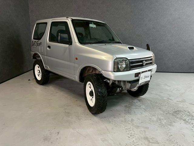 ジムニー ＸＧ　車検９年１０月　ターボ　４ＷＤ　５ＭＴ　マニュアルギヤシフト　キーレス　ＣＤ　ＡＢＳ　ＳＲＳエアバッグ　パワステ　パワーウィンドウ　リフトアップ　アルミホイール（12枚目）