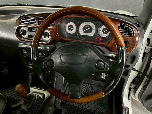 ミラジーノ ジーノ　車検９年１１月　５ＭＴ　マニュアルギヤシフト　キーレス　カセット　ＳＲＳエアバッグ　パワステ　パワーウィンドウ　シートカバー　２ＷＤ（32枚目）