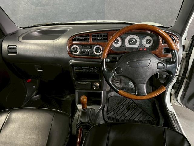 ミラジーノ ジーノ　車検９年１１月　５ＭＴ　マニュアルギヤシフト　キーレス　カセット　ＳＲＳエアバッグ　パワステ　パワーウィンドウ　シートカバー　２ＷＤ（63枚目）