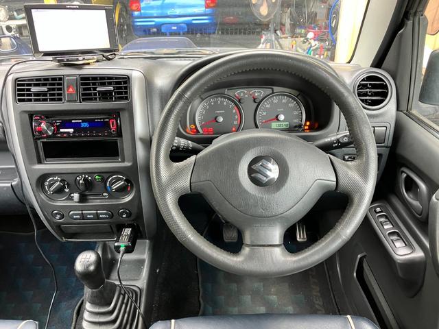 ジムニー ランドベンチャー　特別仕様車　５速ＭＴ　インタークーラーターボ　パートタイム４ＷＤ　高低二段切替式（後輪駆動ベース）　ヒーター付き黒本革シート　ポータブルワンセグナビ　アルミホイール　キーレス（26枚目）