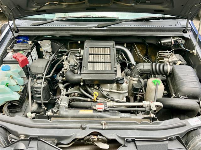 ジムニー ランドベンチャー　特別仕様車　５速ＭＴ　インタークーラーターボ　パートタイム４ＷＤ　高低二段切替式（後輪駆動ベース）　ヒーター付き黒本革シート　ポータブルワンセグナビ　アルミホイール　キーレス（42枚目）