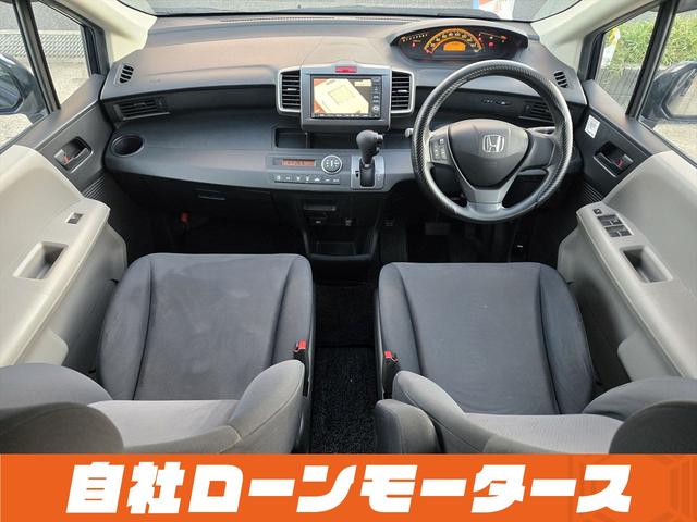 フリード フレックス Fパッケージ 純正HDDナビテレビ CD ミュージックサーバー DVD バックカメラ ステアリングオーディオスイッチ 社外14インチアルミホイール キーレスエントリーキー 電格ウインカーミラー ドアバイザー(10枚目)