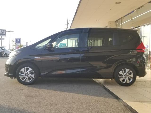 ハイブリッドGホンダセンシング 社外 8インチ HDDナビ/フリップダウンモニター/車線逸脱防止支援システム/ヘッドランプ LED/ETC/EBD付ABS/横滑り防止装置/アイドリングストップ/TV/エアバッグ 運転席(2枚目)