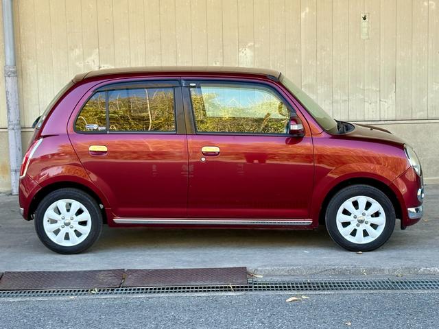 ミラジーノ プレミアムX 距離無制限1年保証付/ユーザー買取/バックカメラ/ナビ/オートエアコン/MOMOウッドステアリング/社外ホワイトアルミ/取説あり/メンテナンスノートあり/トノカバーあり/CD/DVD/車検整備付(46枚目)