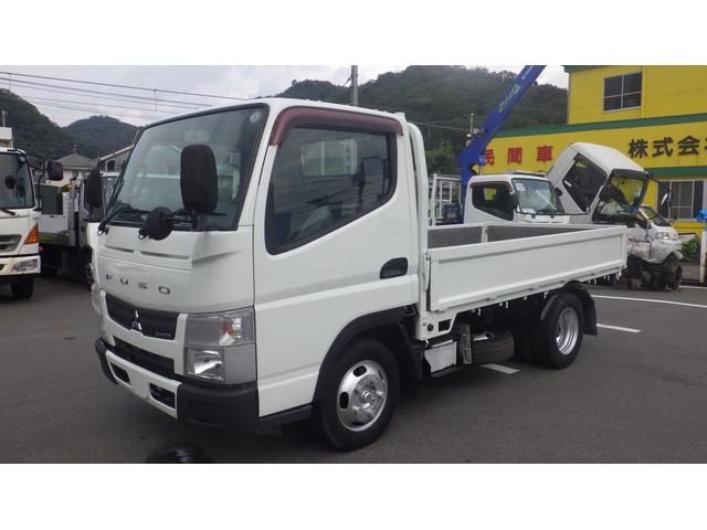 キャンター 全低床　積載２ｔ　５ＭＴ　車両総重量　４，３２５ｋｇ　荷台内寸　長さ：３１０ｃｍ　幅：１６０ｃｍ　高さ：３８ｃｍ　煽内ステン張　エアコン　パワーステアリング　パワーウィンドウ　ディーゼル（4枚目）