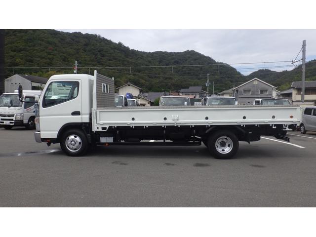 キャンター 超ロング　積載２ｔ　５ＭＴ　車両総重量　４，９６５ｋｇ　荷台内寸　長さ：５００ｃｍ　幅：２０８ｃｍ　高さ：３８ｃｍ　床鉄板　ロープ穴５対　キーレス　ＥＴＣ　フォグ無し　パワーステアリング　パワーウィンドウ（7枚目）