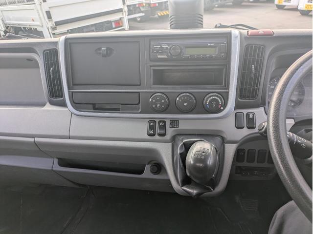 キャンター 　積載３．５ｔ　５ＭＴ　荷台内寸　長さ：５００ｃｍ　幅：２０９ｃ　高さ：３８ｃｍ　車両総重量：６，９２５ｋｇ　ＥＴＣ　セイコーラック　パワーウインドウ　パワーステアリング　助手席側電動格納ミラー（29枚目）