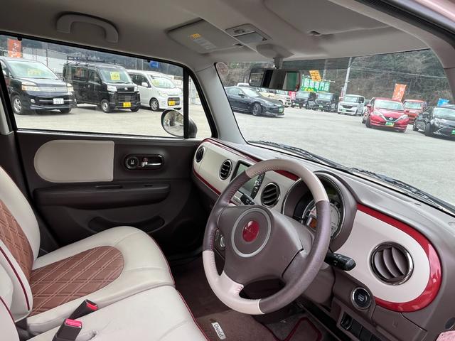 アルトラパンショコラ Ｇ　禁煙車　社外ナビ（ワンセグ／ＡＭ／ＦＭ／ＵＳＢ／ＢＴ）　バックカメラ　純正マット　プッシュスタート　スマートキー　オートライト　アイドリングストップ　革巻きハンドル　バイザー（15枚目）