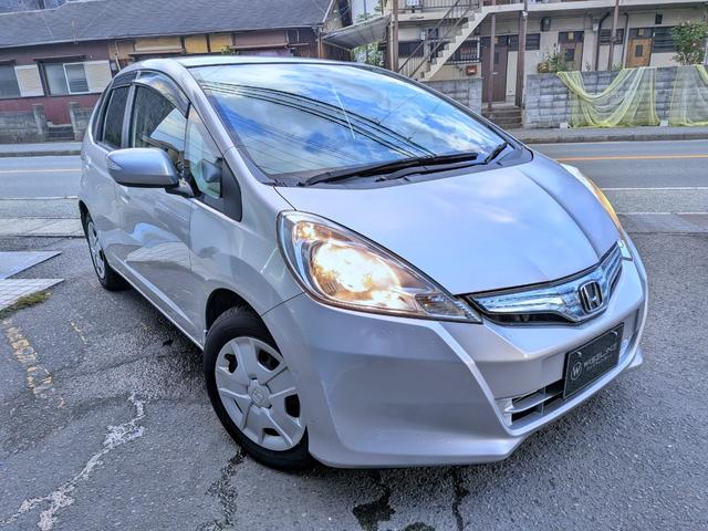 フィットハイブリッド ベースグレード　純正ＣＤ／ＡＵＸ／クルコン／ＥＴＣ／オートＡＣ／禁煙／キーレス／ＥＣＯＮモード／シートリフター／バニティミラー／ウィンカーミラー／チップアップシート（12枚目）