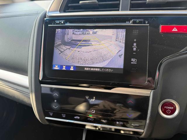 フィットハイブリッド Ｌパッケージ　ハイブリッド　ＥＴＣ　バックカメラ　ナビ　ＴＶ　オートクルーズコントロール　オートライト　スマートキー　電動格納ミラー　ＡＴ　ＣＤ　ＵＳＢ　ＥＳＣ　エアコン　パワーステアリング　パワーウィンドウ（15枚目）