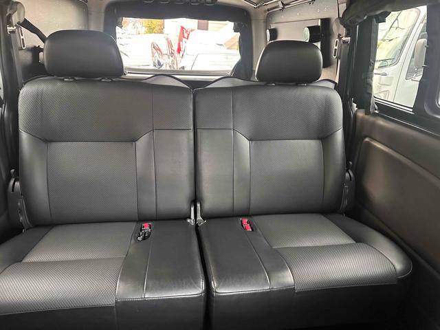 NV350キャラバンバン ロングライダープレミアムGXターボ 4WD ディーゼルターボ ETC2.0/パイオニア製ナビ/バックカメラ/カレディステアリングハンドル/社外ビルシュタインショックアブソーバー/リアベッドキッド車中泊仕様(18枚目)