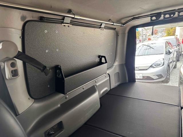 NV350キャラバンバン ロングライダープレミアムGXターボ 4WD ディーゼルターボ ETC2.0/パイオニア製ナビ/バックカメラ/カレディステアリングハンドル/社外ビルシュタインショックアブソーバー/リアベッドキッド車中泊仕様(50枚目)