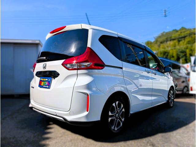 フリード クロスター 天井モニター/大型ナビフルセグTVバックカメラブルートゥース/衝突軽減ブレーキサポート/前後ミラー型ドラレコ/両側パワースライドドア/リヤフィルム施工済み/クラッツィオ黒革調カバー/両席シートヒーター(19枚目)