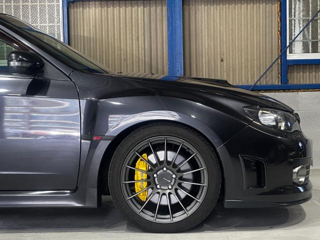 インプレッサ ＷＲＸ　ＳＴｉ　エンケイ１８インチ　ＴＥＩＮ車高調　アペックスマフラー　ＳＴＩスポイラー　シムスレーシングリアバンパー　Ｐａｎａｓｏｎｉｃフローティングナビ　フルセグ　ＨＩＤ　クリフォード　タイベル交換済み（12枚目）