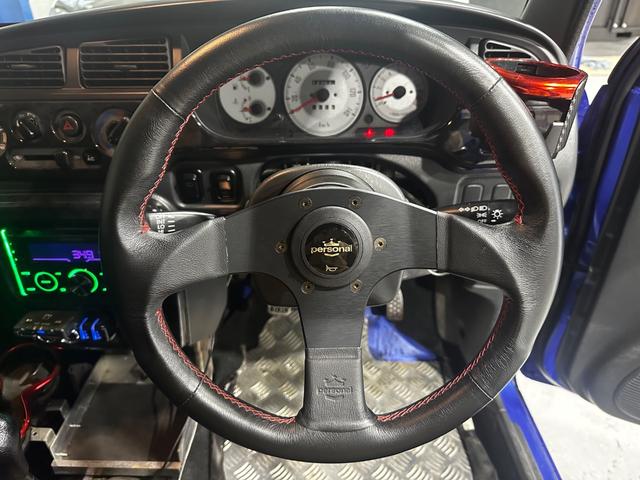 ミラジーノ ミニライトスペシャルターボ　４ＷＤ　ターボ　５ＭＴ　車高調　社外ステアリング　社外１４インチＡＷ　ＥＴＣ　キセノンライト（19枚目）