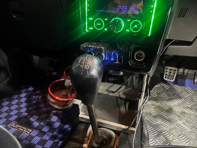 ミラジーノ ミニライトスペシャルターボ　４ＷＤ　ターボ　５ＭＴ　車高調　社外ステアリング　社外１４インチＡＷ　ＥＴＣ　キセノンライト（23枚目）