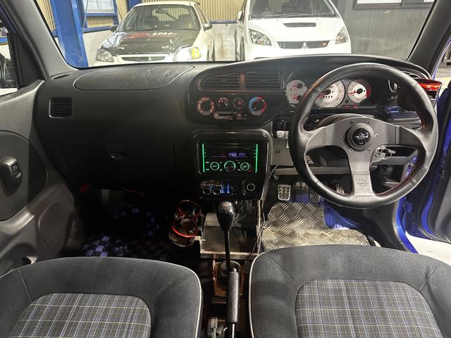 ミラジーノ ミニライトスペシャルターボ　４ＷＤ　ターボ　５ＭＴ　車高調　社外ステアリング　社外１４インチＡＷ　ＥＴＣ　キセノンライト（25枚目）