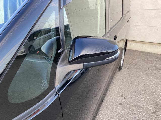 ヴォクシー ハイブリッドＶ　純正９インチナビ・純正フリップダウンモニター・クルーズコントロール・ＬＥＤヘッドライト・両側パワースライドドア・前席シートヒーター・２列目キャプテンシート・リアオートエアコン・バックモニター・スマート（11枚目）