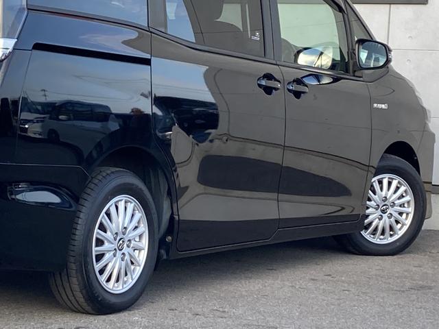 ヴォクシー ハイブリッドＶ　純正９インチナビ・純正フリップダウンモニター・クルーズコントロール・ＬＥＤヘッドライト・両側パワースライドドア・前席シートヒーター・２列目キャプテンシート・リアオートエアコン・バックモニター・スマート（16枚目）