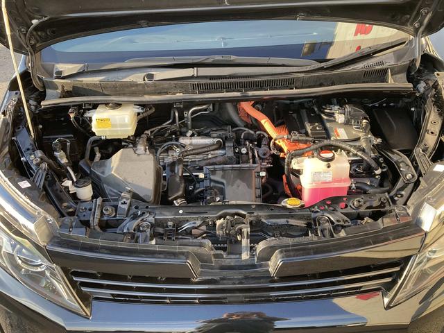 ヴォクシー ハイブリッドＶ　純正９インチナビ・純正フリップダウンモニター・クルーズコントロール・ＬＥＤヘッドライト・両側パワースライドドア・前席シートヒーター・２列目キャプテンシート・リアオートエアコン・バックモニター・スマート（50枚目）