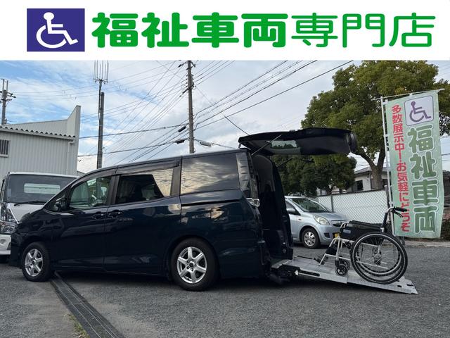 ヴォクシー 　両側電動スライドドア　スマートキー　プッシュスタート　バックカメラ　後席モニター　ＥＴＣ車載器　カロッツェリアナビ　ＣＤ　ＤＶＤ　フルセグ　Ｂｌｕｅｔｏｏｔｈ　スタッドレスタイヤ　アイドリングストップ（2枚目）