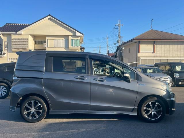フリードスパイクハイブリッド ハイブリッド　車両品質評価書付・Ｋｅｎｗｏｏｄフローティングナビ・バックカメラ・Ｂｌｕｅｔｏｏｔｈ・ＤＶＤ・ＣＤ・ＥＴＣ・フルセグ・オートエアコン・両側スライドドア・社外アルミホイール・横滑り防止（13枚目）