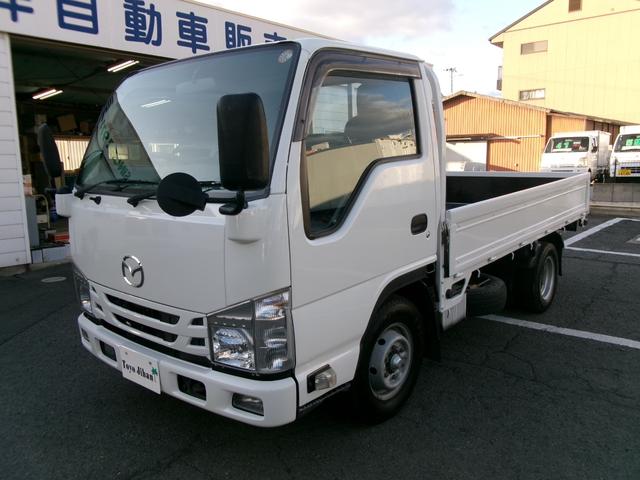タイタントラック 　２ｔ低床平ボディ　エアコン　パワステ　パワーウィンドウ　エアーバック　５速マニュアルミッショ　ＡＢＳ　電格ミラー　キーレス　ＨＳＡ　ＥＴＣ　外装仕上げ済み　リースアップ車（2枚目）