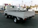 トヨエース 　１．２ｔ９尺低床平ボディ　ＡＴ車　３，０００ｃｃディーゼルターボ　エアコン　パワステ　パワーウィンドウ　エアーバック　集中ロック　ＥＴＣ　社外ナビ　スタッドレスタイヤ　外装仕上げ済み　リースアップ車（3枚目）